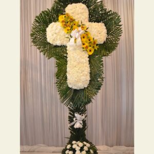 CR0500: White carnation cross with yellow break and palm leaf